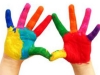 Children's hands painted in colour at a nursery